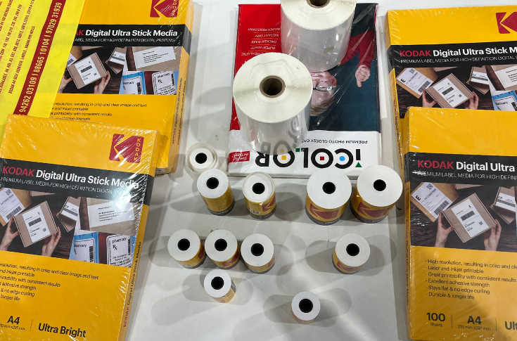 Kodak exhibition booth displaying photo paper, plotter rolls, and wide-format printing media at a trade show, highlighting solutions for photography, CAD printing, and signage applications