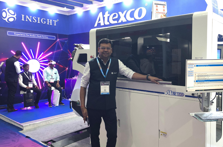 Insight Print Communications displaying the Atexco Vega Press Mini monochrome printer and VR-enabled digital book printing solutions at PrintPack 2025