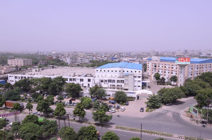 UFlex packaging films manufacturing facilities showing advanced BOPET and CPP production lines, including large-scale extrusion and metallising equipment in India and Russia, highlighting expansion in polyester chips and film production capacity