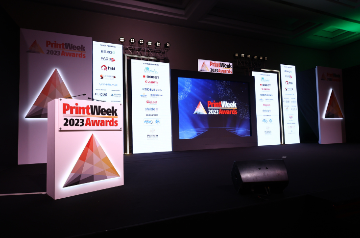 Overview of PrintWeek Awards Jury Week featuring innovative packaging samples such as monolayer cartons, refillable dispenser packaging, decorative liquor cartons with foil and cutouts, corrugated art installations, and sustainable print solutions using PCR materials, embossing, and spot UV finishing