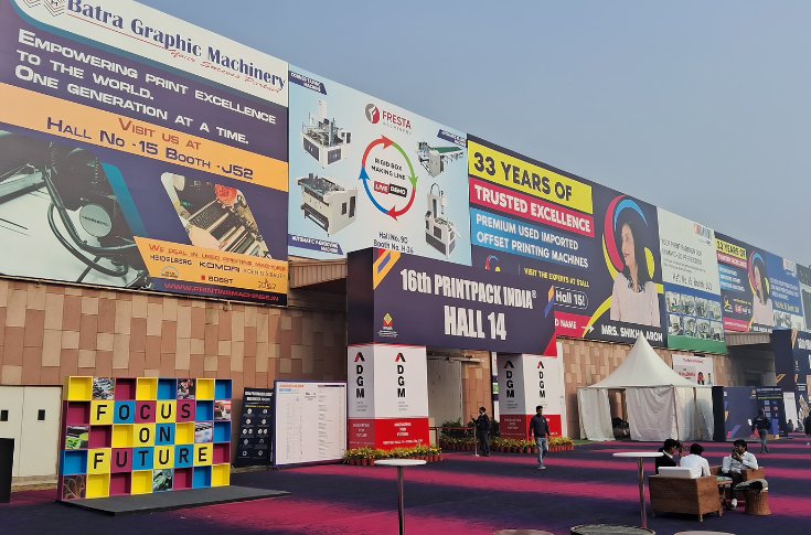 Conway Machine displaying die-cutter gripper bars and replacement components alongside Druck & Bindung presenting an automatic collapsible box assembly machine at PrintPack 2025