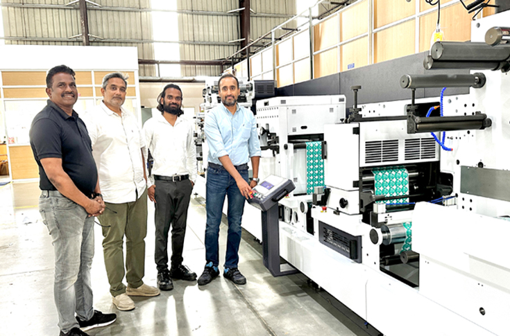 Dhanlakshmi Labels using Rhyguan Plus-420 modular digital finishing machine with servo-driven die-cutting and flexo units for FMCG and liquor label production