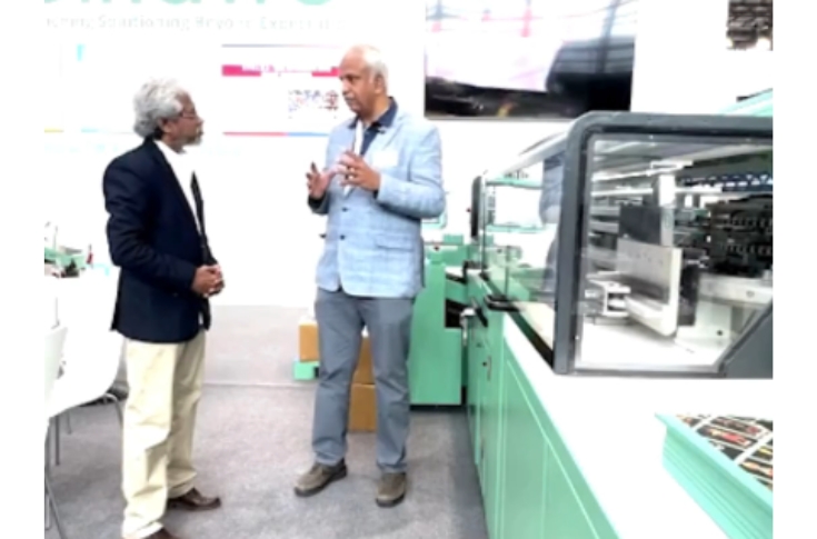 Palippuram Sajith of Impel Services presenting Bindwel bookbinding and print-finishing machines at Drupa exhibition, highlighting automation, productivity, and advanced binding solutions for the printing industry
