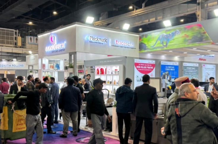 Monotech Systems demonstrating Plockmatic print finishing equipment at PrintPack India 2025, showing live operation of automated booklet maker, creaser, digital die-cutter, and binder systems