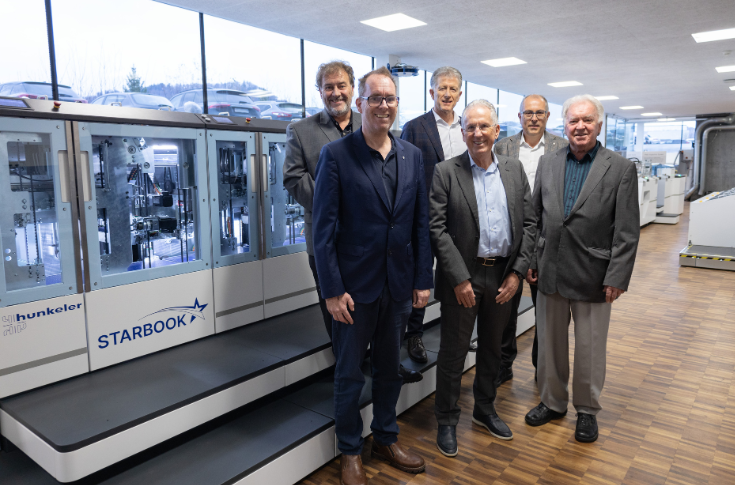 Muller Martini and Hunkeler executives announcing the merger of the two Swiss printing technology companies specialising in finishing systems and high-speed digital printing solutions