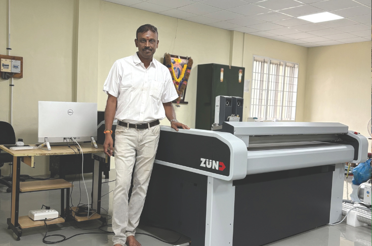 Zünd cutting table used for precise sample making and short-run packaging production including mono cartons, sandwich boxes, and rigid boxes without die cutting