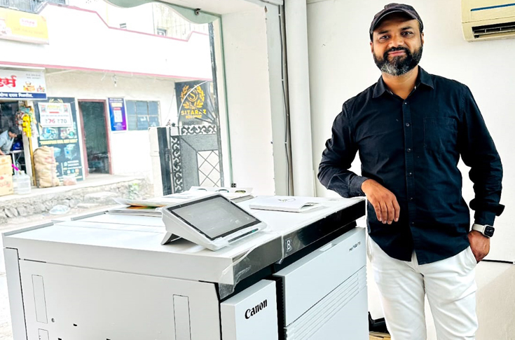 Canon imagePRESS V700 digital production printing press used at Vinod Printers for sticker, brochure, leaflet, and wedding card printing, offering high-speed output and versatile media handling for commercial print applications