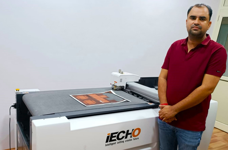 Iecho PK 0705 Plus digital cutting machine in a packaging facility producing precise box prototypes with advanced automation and finishing equipment