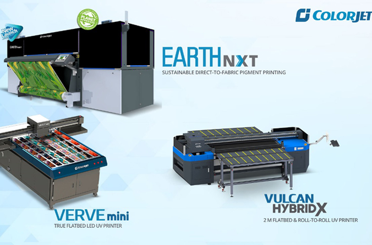 ColorJet display at FESPA showing Vulcan Hybrid roll-to-roll and flatbed printer, Verve Mini UV flatbed printer, and Earth NXT digital textile printing system with 10-color configuration highlighting sustainable, eco-friendly printing solutions
