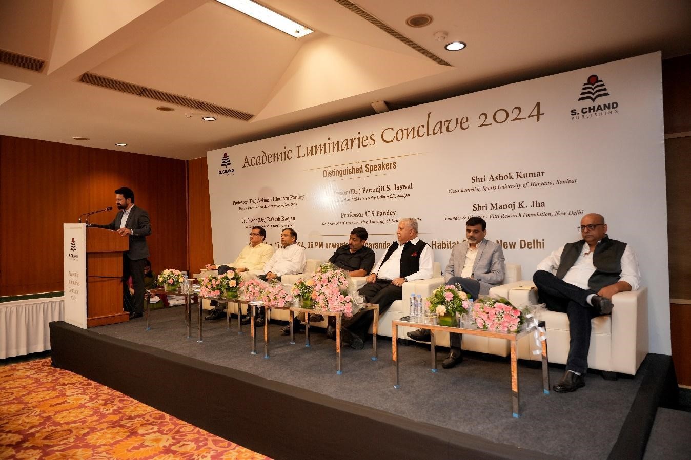 Higher education conference panel discussion with policymakers and experts debating NEP implementation, teacher shortages, and technology integration with audience interaction session