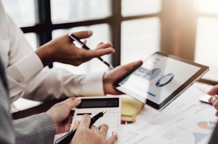 Business professionals analyzing IBM CMO Study 2025 insights on marketing leadership in India, highlighting AI adoption, customer experience strategies, and evolving CMO responsibilities