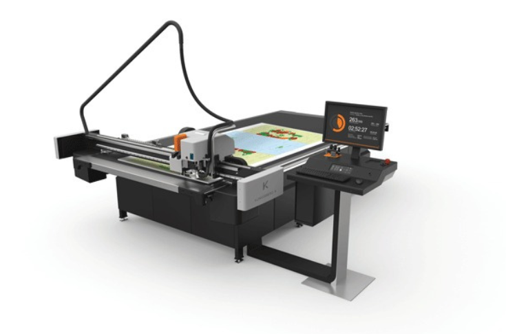 Kongsberg X24 cutting table in operation for signage, display, and packaging production, showcasing high-speed precision cutting and finishing for industrial print applications
