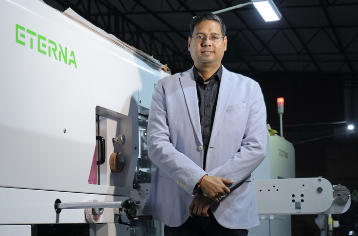 Packaging production facility at DK Printers in Varanasi operating the Bobst Eterna Ecut 1060 die-cutter with stripper unit, processing duplex and corrugated sheets for pharma, food, and incense packaging boxes with automated workflow