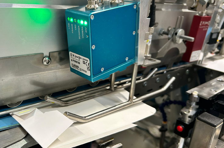 GlueChek+ automated carton inspection system using high-speed cameras and ClearVision software to detect adhesive application defects in real time on folder-gluer machines without UV additives, highlighting sustainable packaging quality control technology