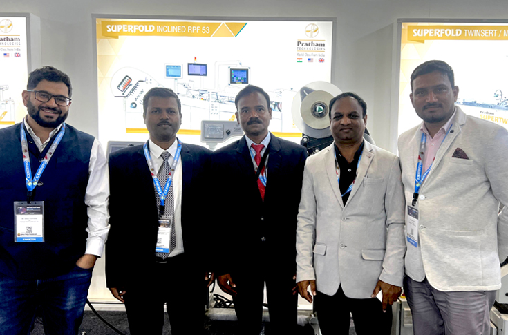 Pratham Technologies display at PrintPack 2025 featuring fully automatic paper folding machine for commercial, book, and pharmaceutical leaflet folding, along with carton feeder and post-press automation equipment