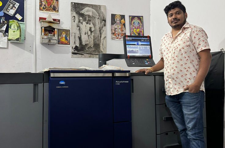Digital print production setup featuring Konica Minolta AccurioPress C7090 alongside cutting, plotting, and lamination machines for integrated in-house printing and finishing workflows