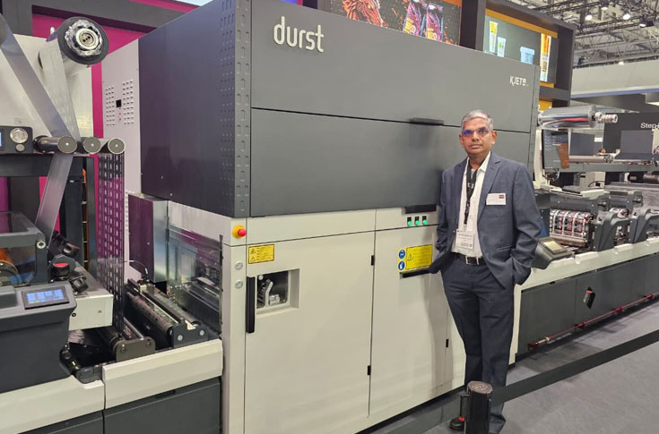 Newgen Printronics team announcing Durst RSC digital press deals and IML and shrink sleeve converting line orders at Labelexpo Europe 2025, highlighting packaging machinery solutions and industry partnerships