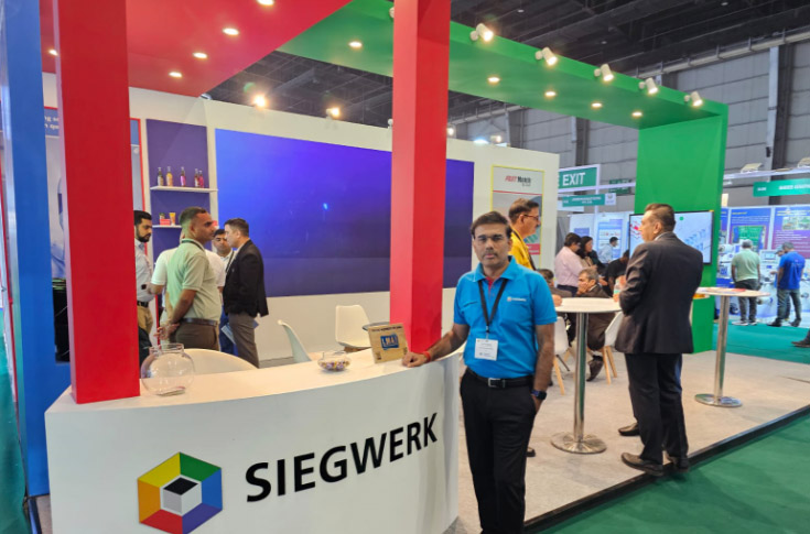 Siegwerk representative Ajit Singh presenting sustainable ink solutions including Sicura Flex Dual Cure series, low-migration inks, and FastMatch Cloud colour matching system at packaging industry exhibition