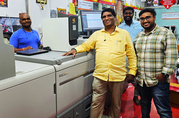 Mahadeva Digital Press operating the Ricoh Pro C7500 for creative commercial printing with metallic, neon, and textured graphic applications